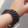mala-legno Mala in legno su filo elastico con nodo dell'infinito