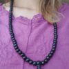 mala-legno-elastico Mala in legno su filo elastico con nodo dell'infinito